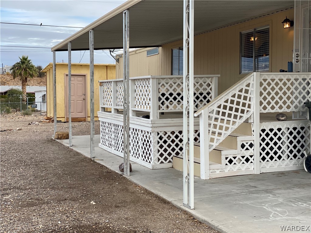 1709 Talc Road Bullhead City, AZ 86442 - Photo 2 of 29 a view of a house with wooden fence
