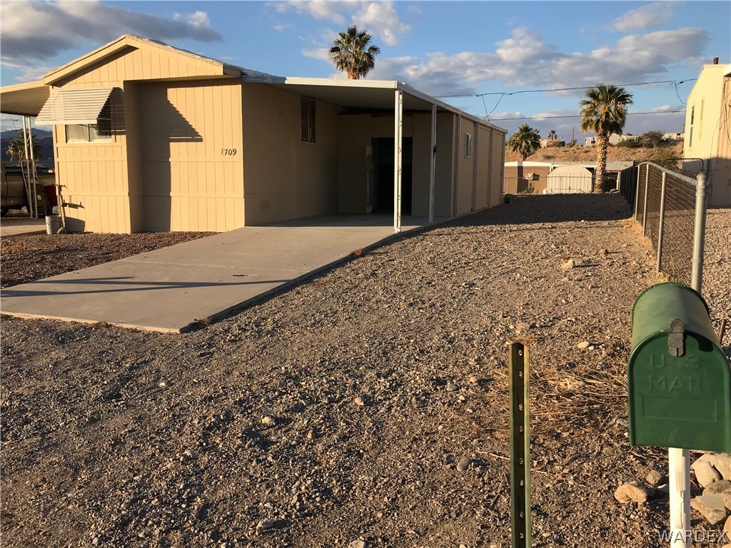 1709 Talc Road Bullhead City, AZ 86442 - Photo 26 of 29 a front view of a house with a yard