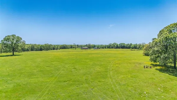 a view of an ocean and a yard