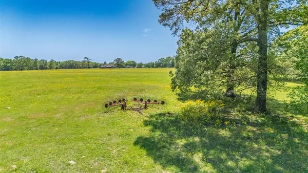 a view of a lake with a yard