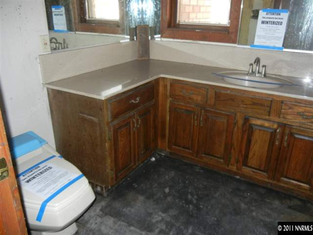 7801 Lakeside Drive Reno, NV 89511 - Photo 4 of 13 a bathroom with a sink and a mirror