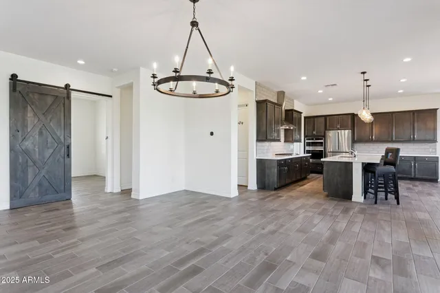 a view of a kitchen with a sink and a stove top oven