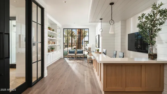 a spacious bathroom with a granite countertop sink a mirror and shower