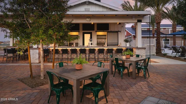 an outdoor space with a table and chairs