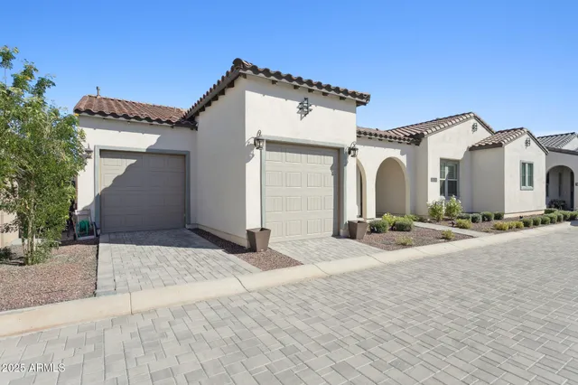 a balcony with furniture and a garden