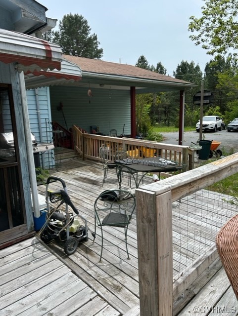 1933 South Genito Road Burkeville, VA 23922 - Photo 12 of 25 a view of a balcony with chairs and wooden floor