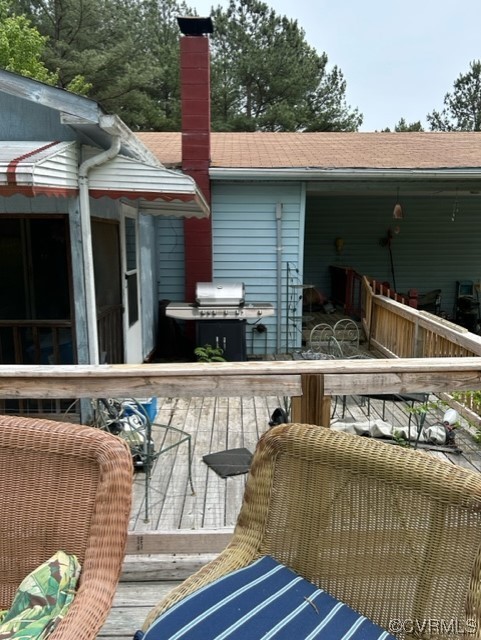 1933 South Genito Road Burkeville, VA 23922 - Photo 10 of 25 a roof deck with table and chairs and wooden floor