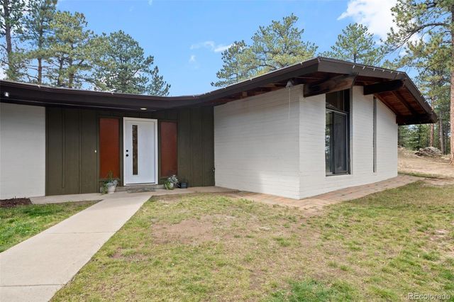 a front view of a house with yard
