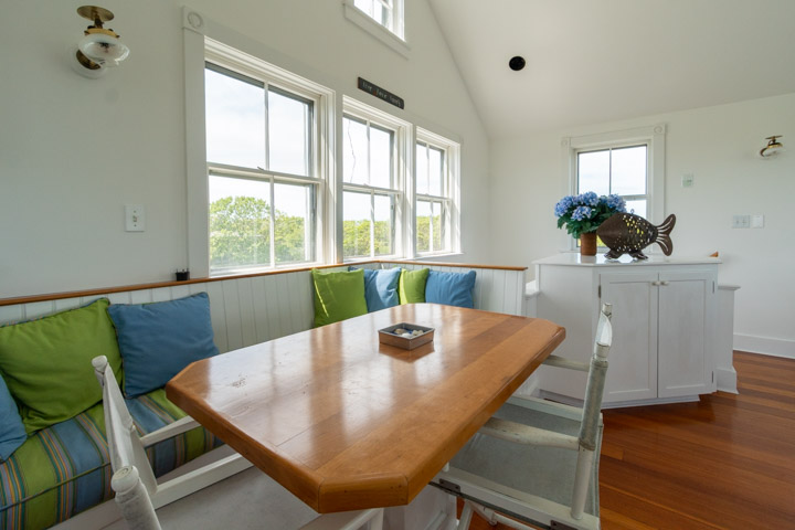 94-21 Tuckernuck Nantucket, MA 02554 - Photo 9 of 20 a view of a dining room with furniture and wooden floor