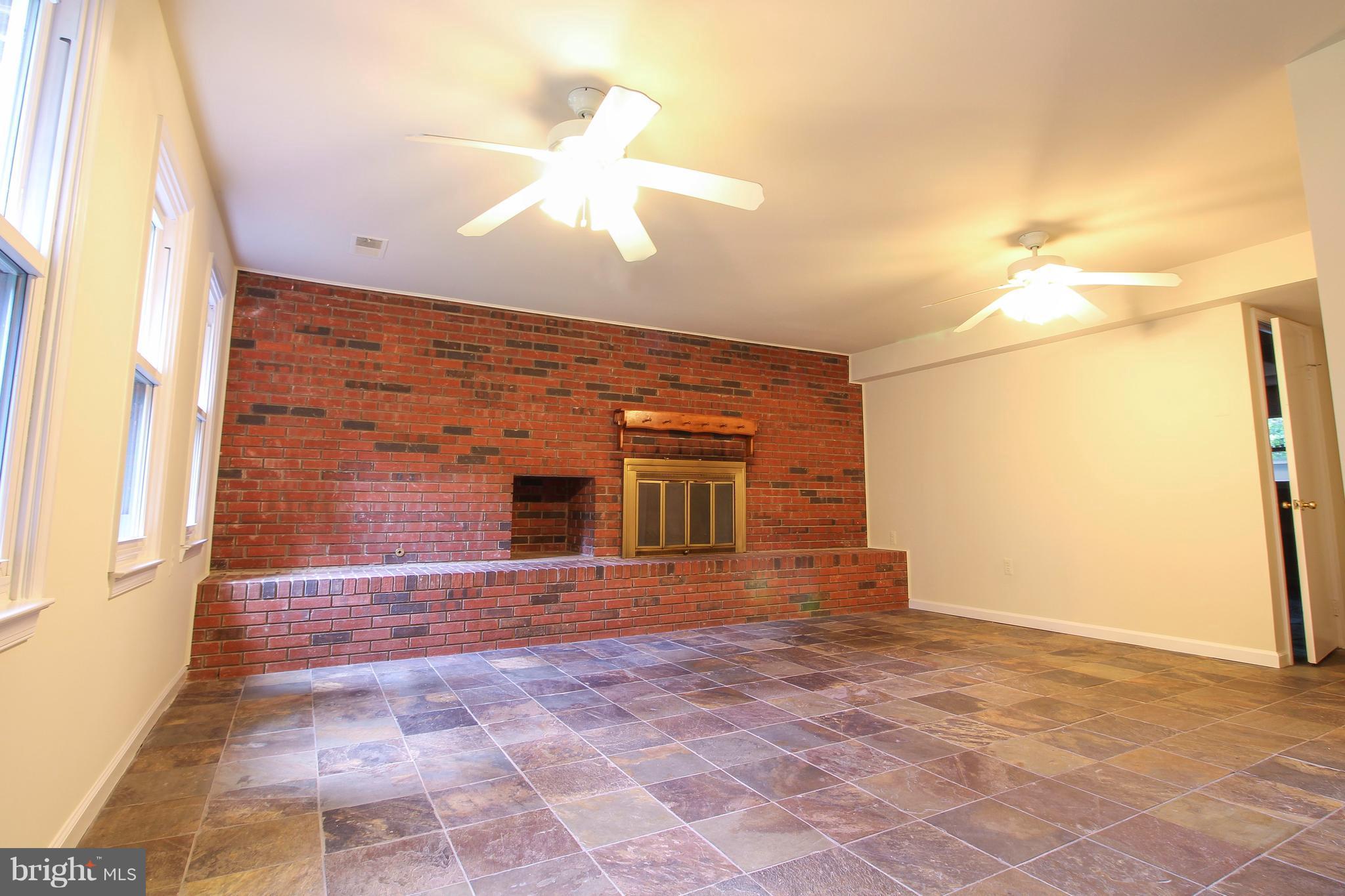 11913 Smithfield Road Manassas, VA 20112 - Photo 24 of 26 Large family room in lower level w/Ceramic Tile