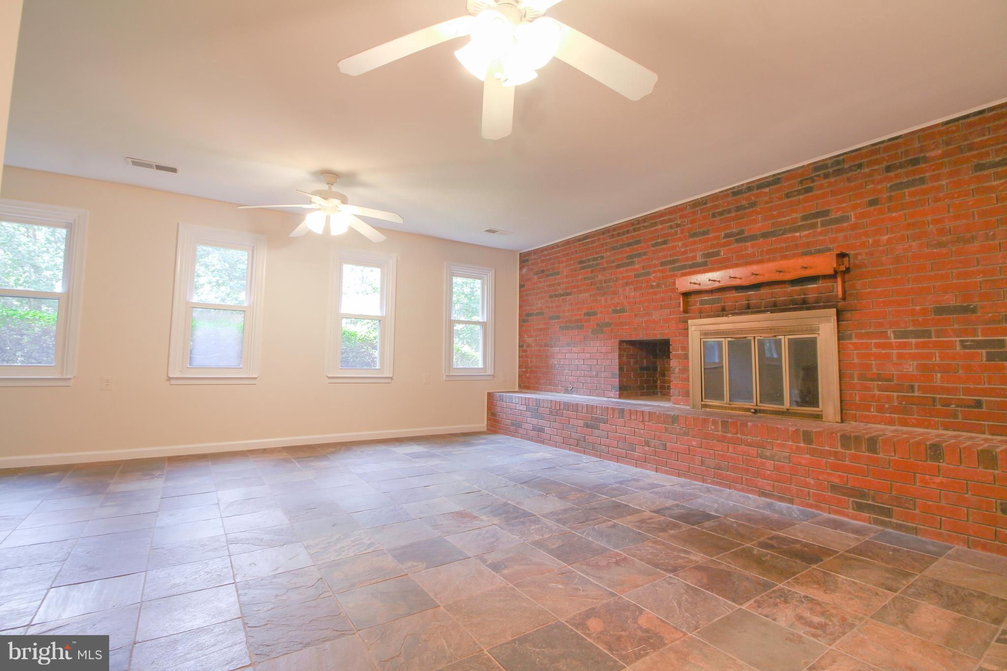11913 Smithfield Road Manassas, VA 20112 - Photo 25 of 26 Cozy fireplace in family room