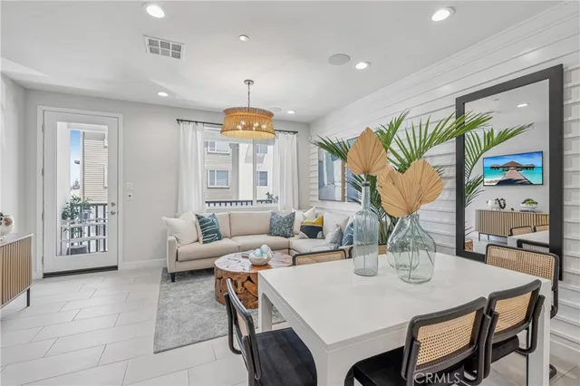 a large kitchen with a table and chairs