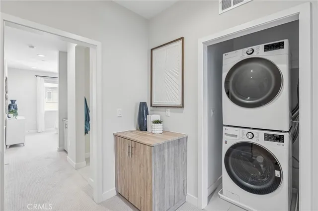 a view of a hallway with washer and dryer