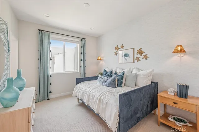 a bedroom with a bed and a couch