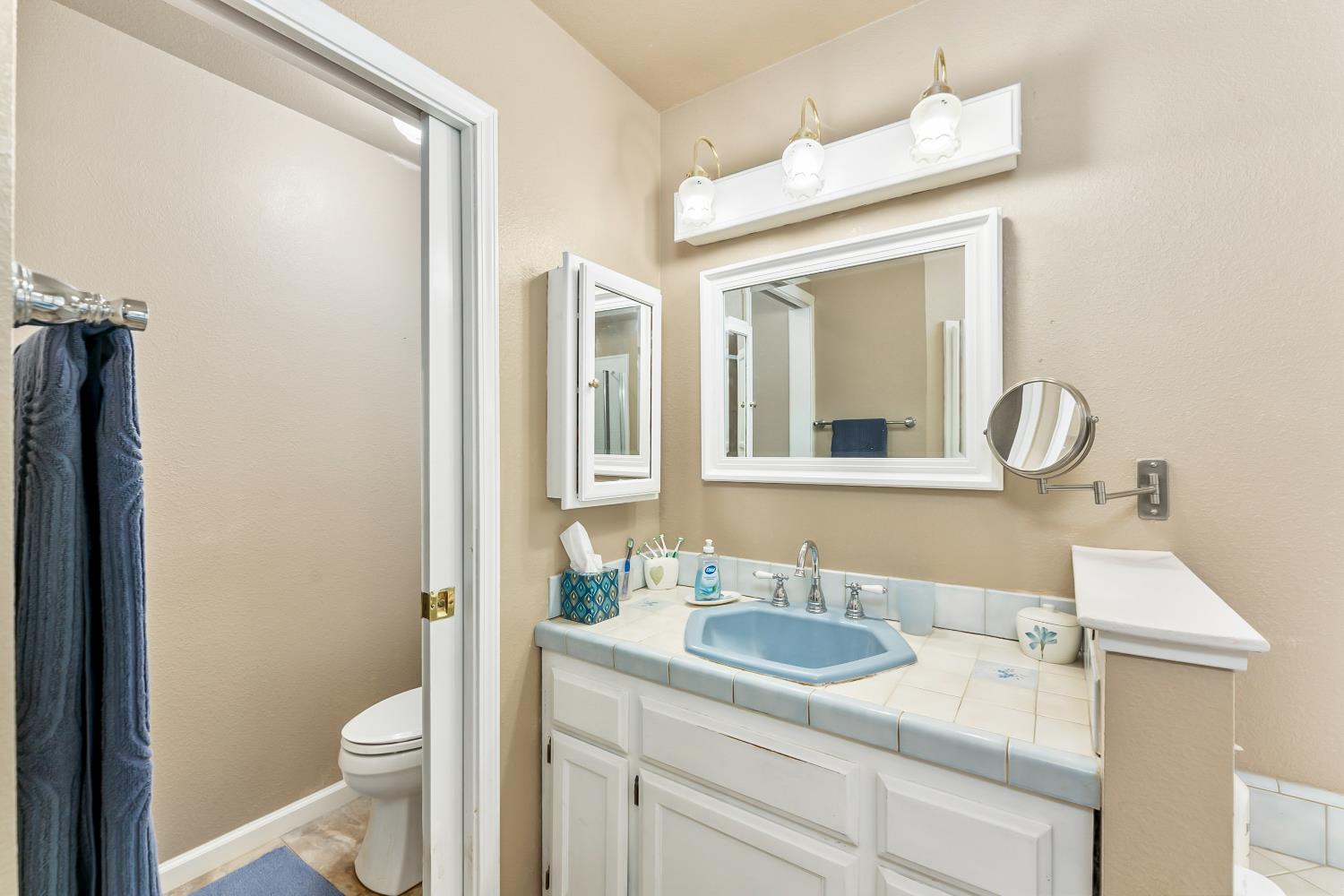 3472 See View Court Rescue, CA 95672 - Photo 20 of 37 a bathroom with a sink and a mirror