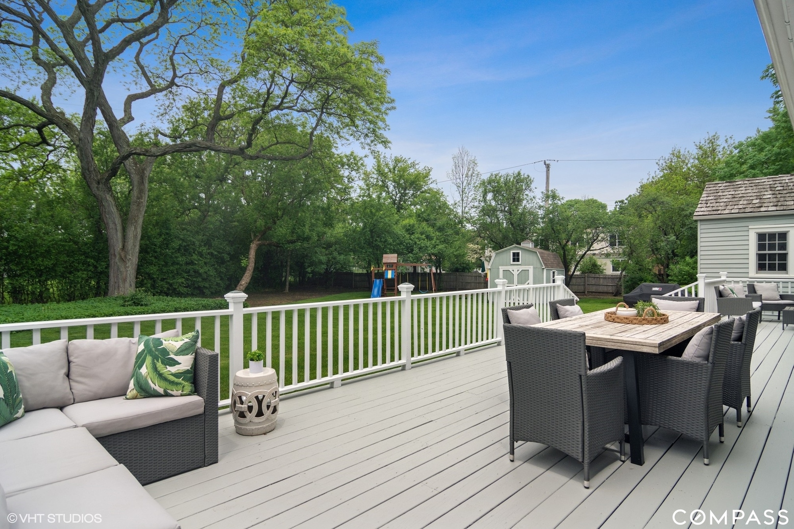 1030 Inverlieth Road Lake Forest, IL 60045 - Photo 22 of 30 a view of a deck with a table and chairs