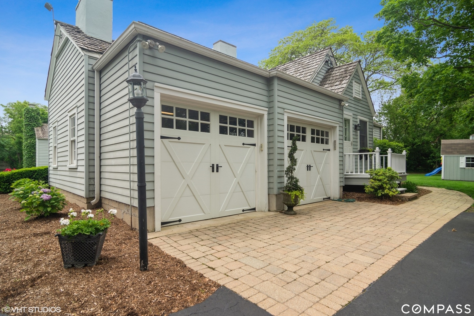 1030 Inverlieth Road Lake Forest, IL 60045 - Photo 24 of 30 a front view of a house with garden