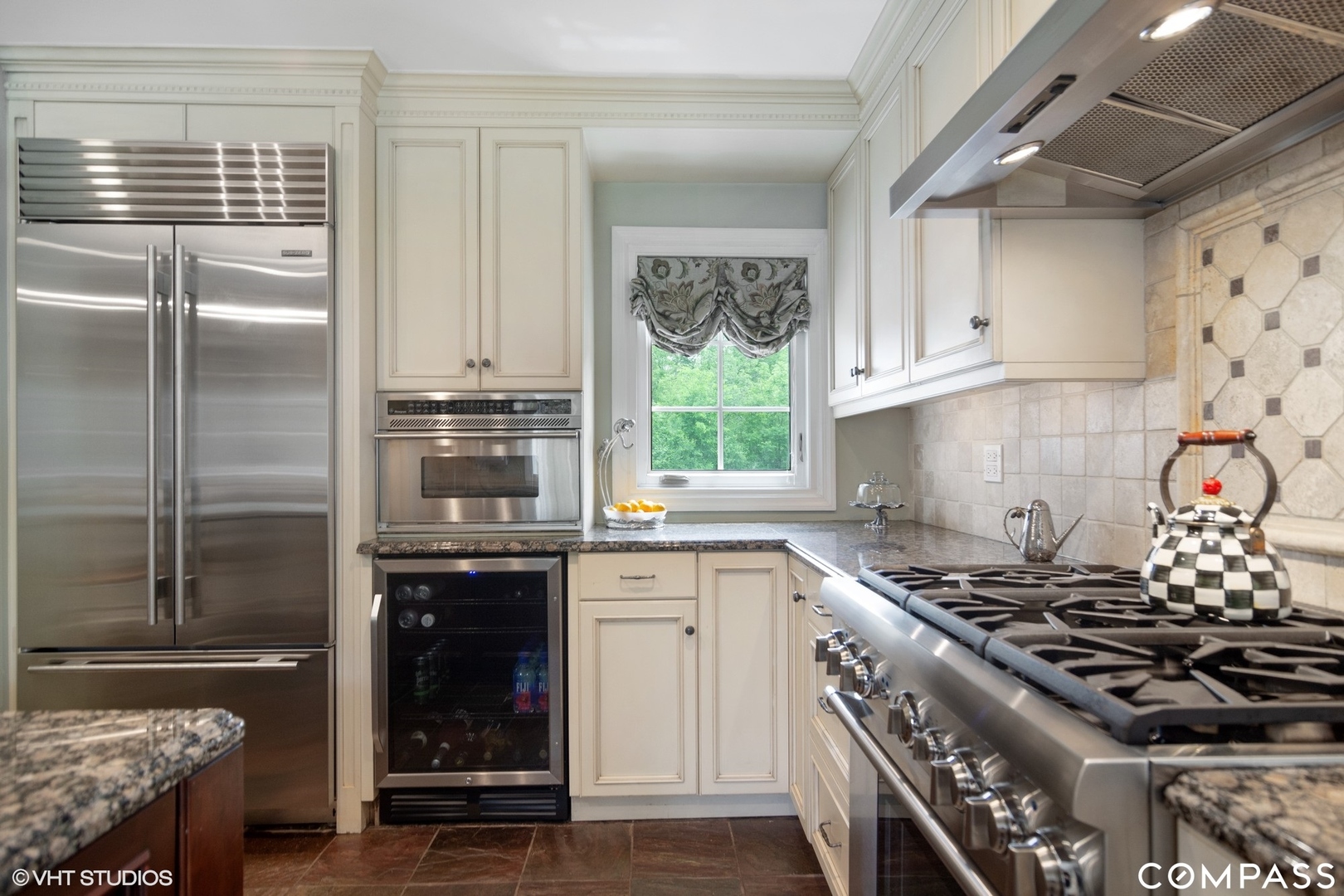 1030 Inverlieth Road Lake Forest, IL 60045 - Photo 6 of 30 a kitchen with stainless steel appliances granite countertop a stove and a refrigerator