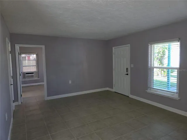 an empty room that has a window