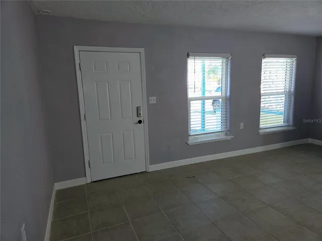 an empty room with windows