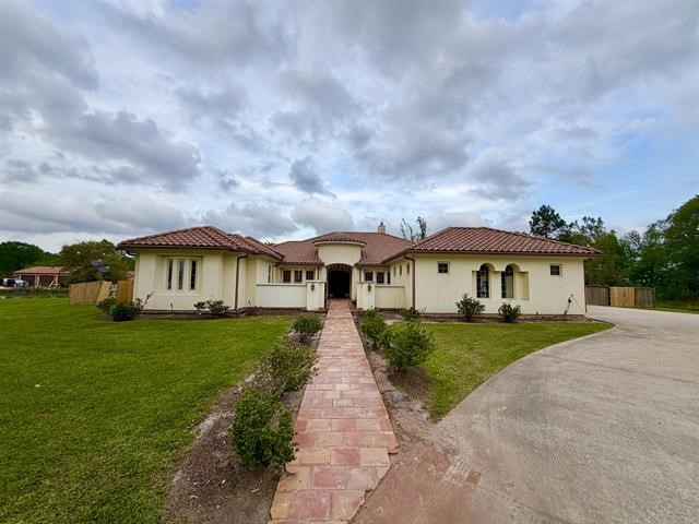 12410 Keith Road Beaumont, TX 77713 - Photo 2 of 45 a front view of a house with yard