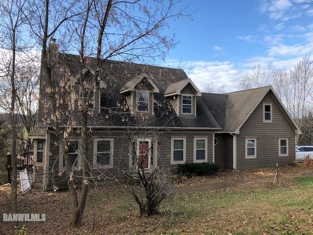 8 Heatherdowns Lane Galena, IL 61036 - Photo 1 of 39 a front view of a house with a yard
