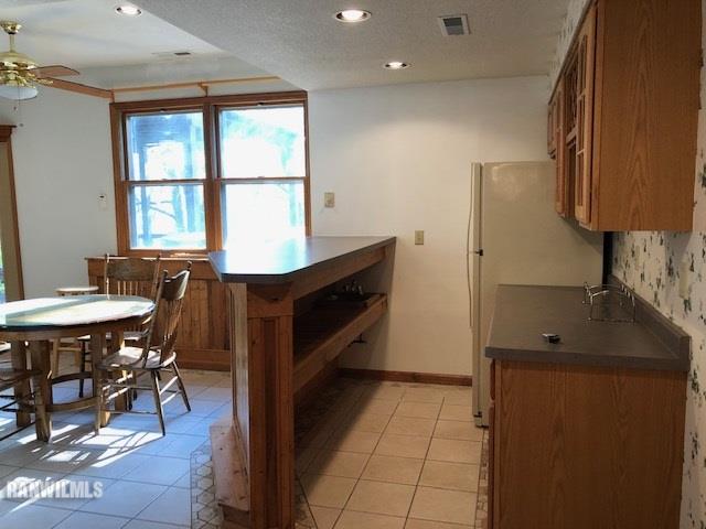 8 Heatherdowns Lane Galena, IL 61036 - Photo 20 of 39 a kitchen with stainless steel appliances granite countertop a refrigerator and a stove top oven