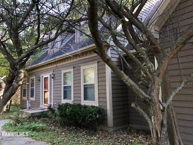 8 Heatherdowns Lane Galena, IL 61036 - Photo 2 of 39 a front view of a house with garden