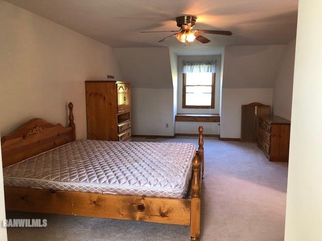 8 Heatherdowns Lane Galena, IL 61036 - Photo 27 of 39 a bedroom with a bed and a chandelier