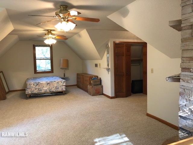 8 Heatherdowns Lane Galena, IL 61036 - Photo 29 of 39 a bedroom with furniture and a chandelier