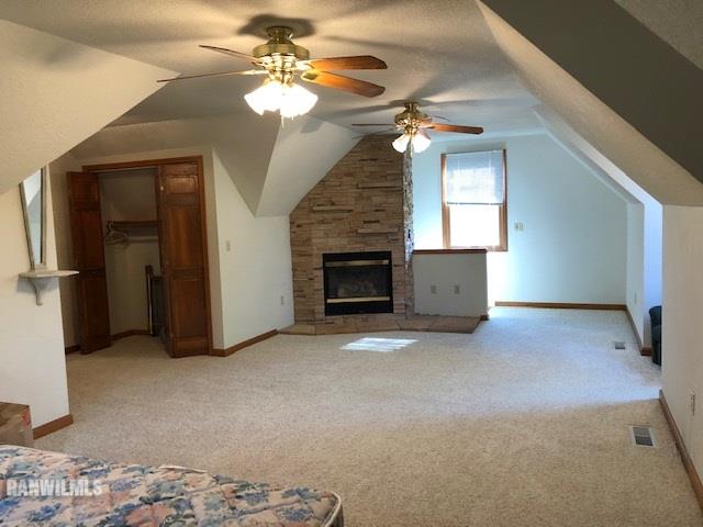 8 Heatherdowns Lane Galena, IL 61036 - Photo 30 of 39 a view of a livingroom with a fireplace a ceiling fan and a ceiling fan