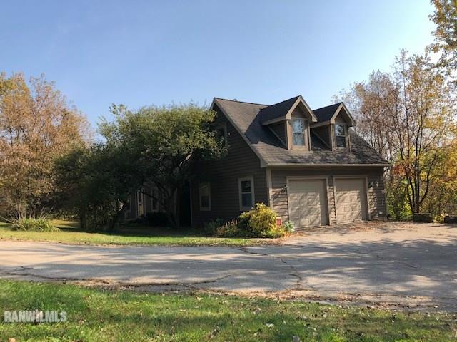 8 Heatherdowns Lane Galena, IL 61036 - Photo 3 of 39 a front view of a house with a yard