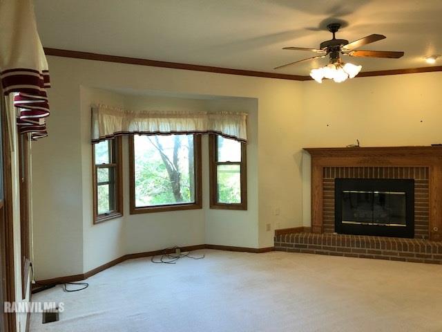 8 Heatherdowns Lane Galena, IL 61036 - Photo 8 of 39 an empty room with chandelier fan and windows