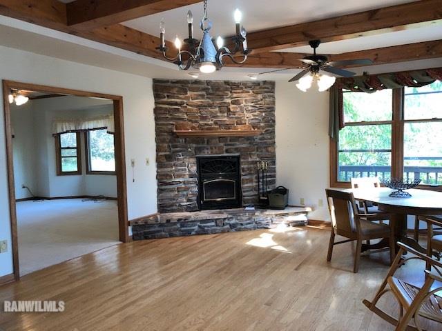 8 Heatherdowns Lane Galena, IL 61036 - Photo 9 of 39 a view of a livingroom with furniture window and wooden floor