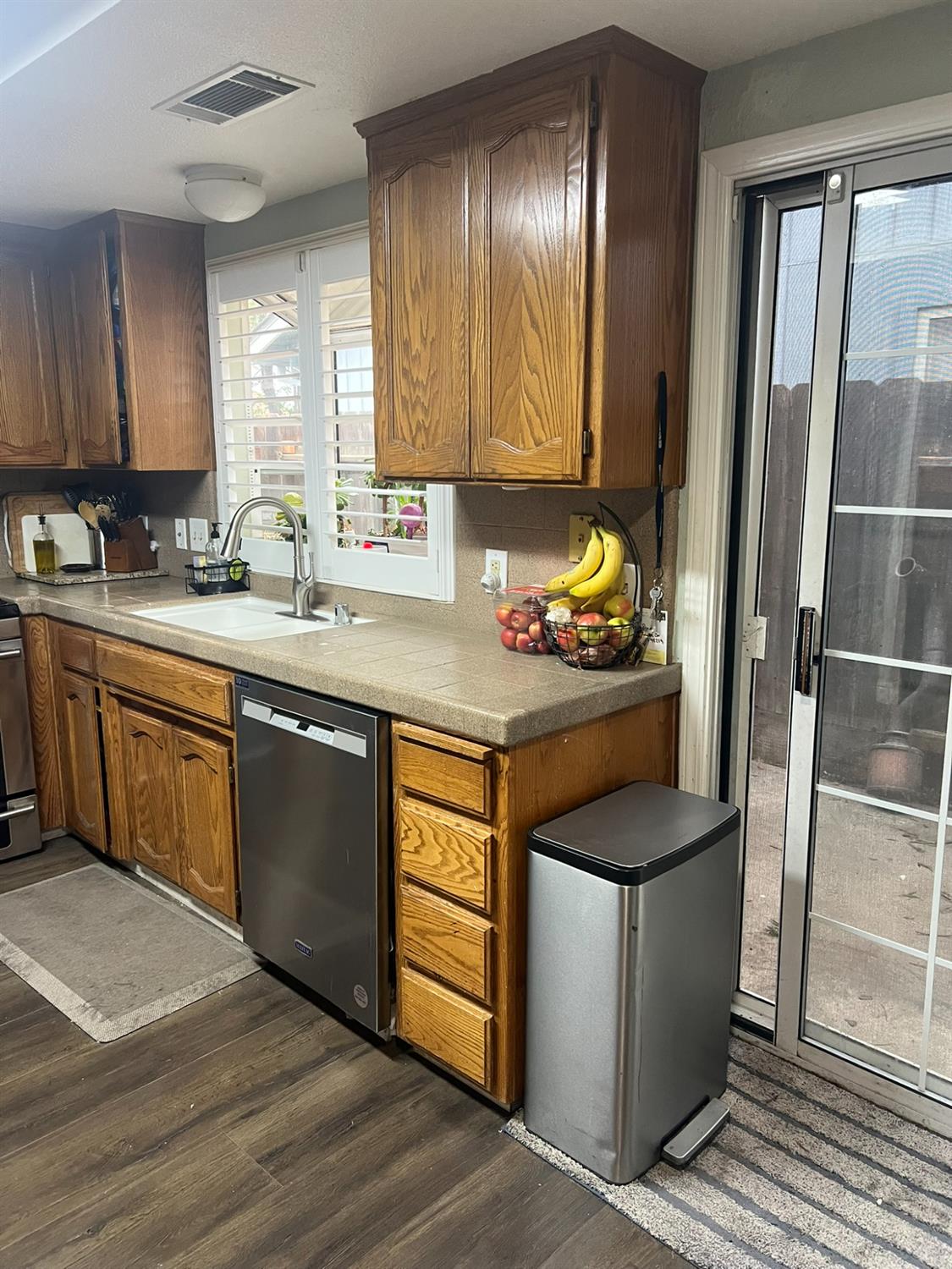 1143 Brownie Court Merced, CA 95340 - Photo 19 of 27 a kitchen with stainless steel appliances granite countertop a sink stove and cabinets