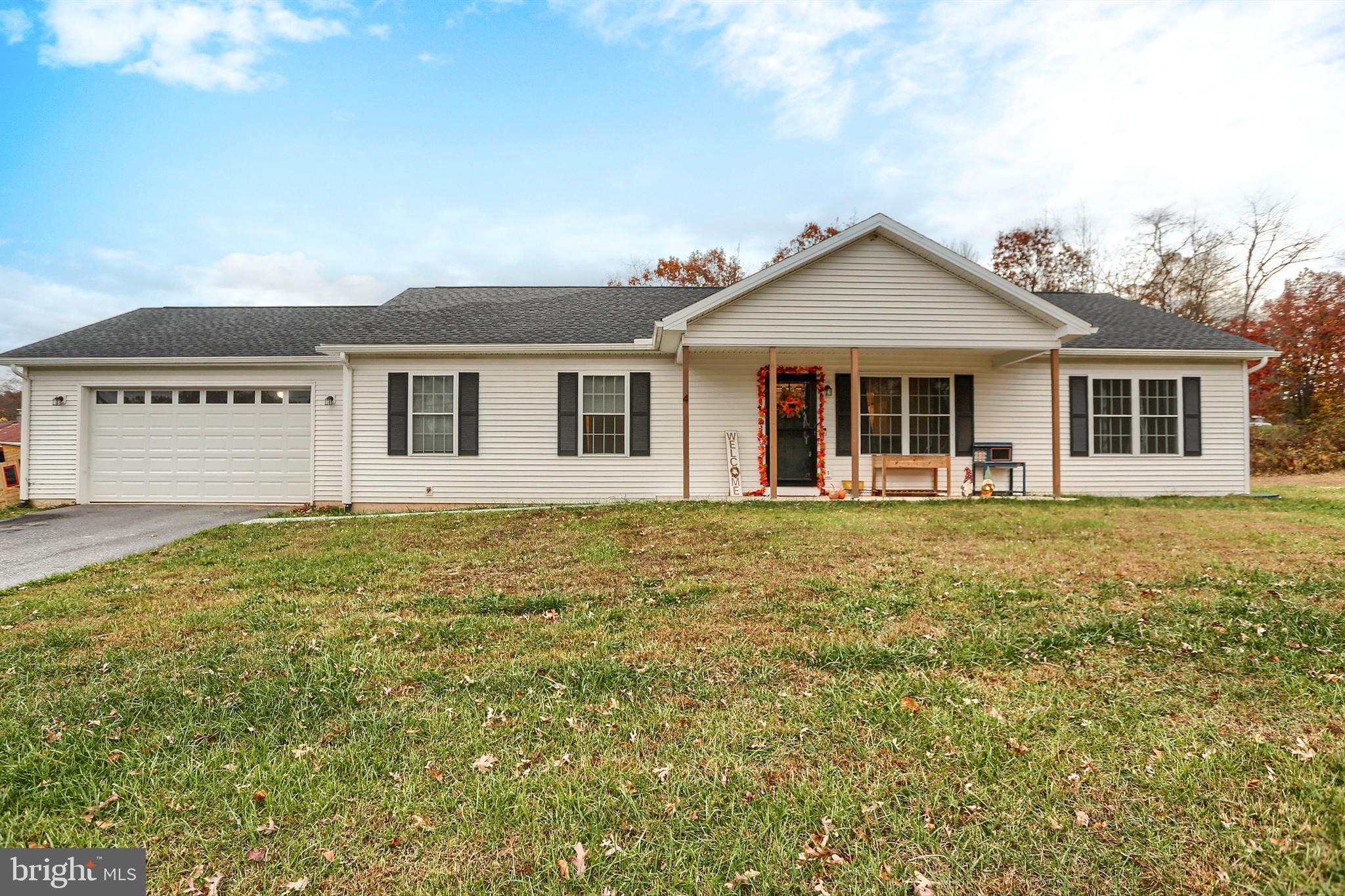 405 Small Valley Road Halifax, PA 17032 - Photo 1 of 36 a front view of a house with a garden