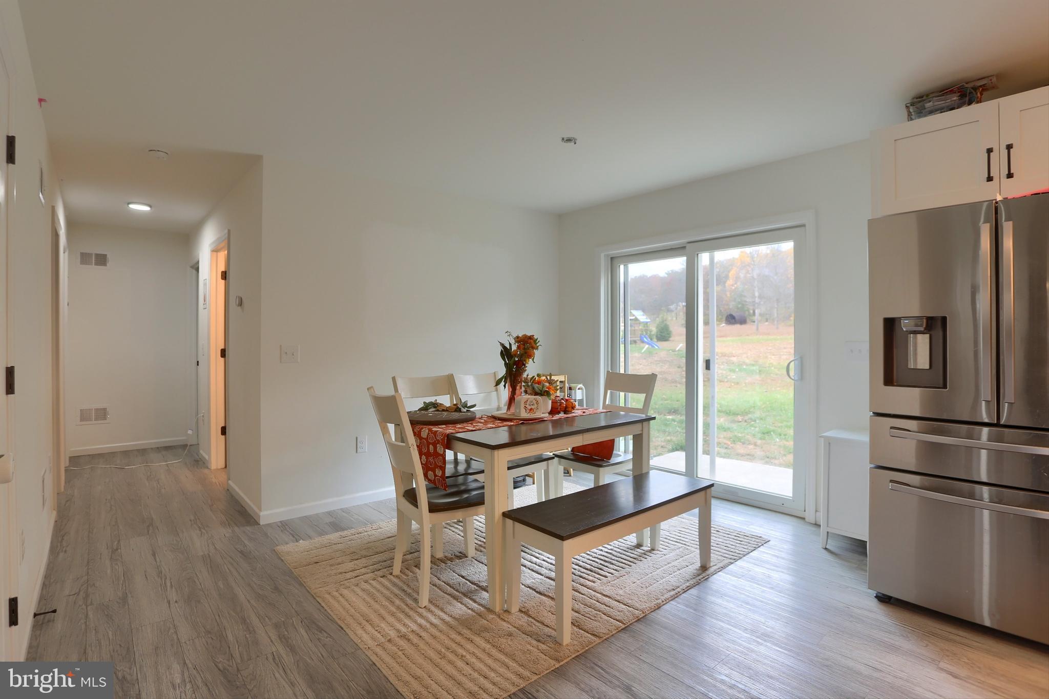 405 Small Valley Road Halifax, PA 17032 - Photo 12 of 36 a work room with furniture wooden floor and a refrigerator