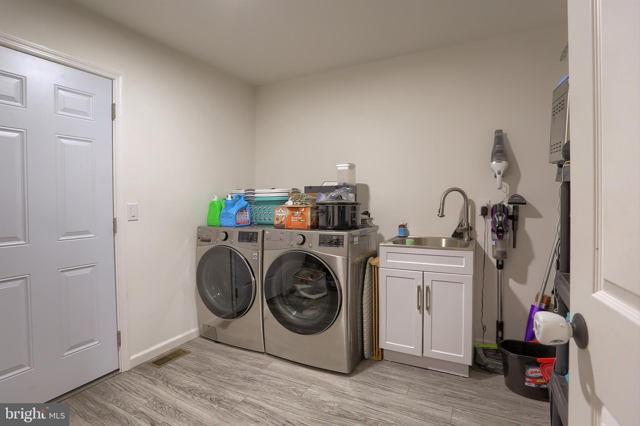 405 Small Valley Road Halifax, PA 17032 - Photo 21 of 36 a utility room with sink dryer and washer
