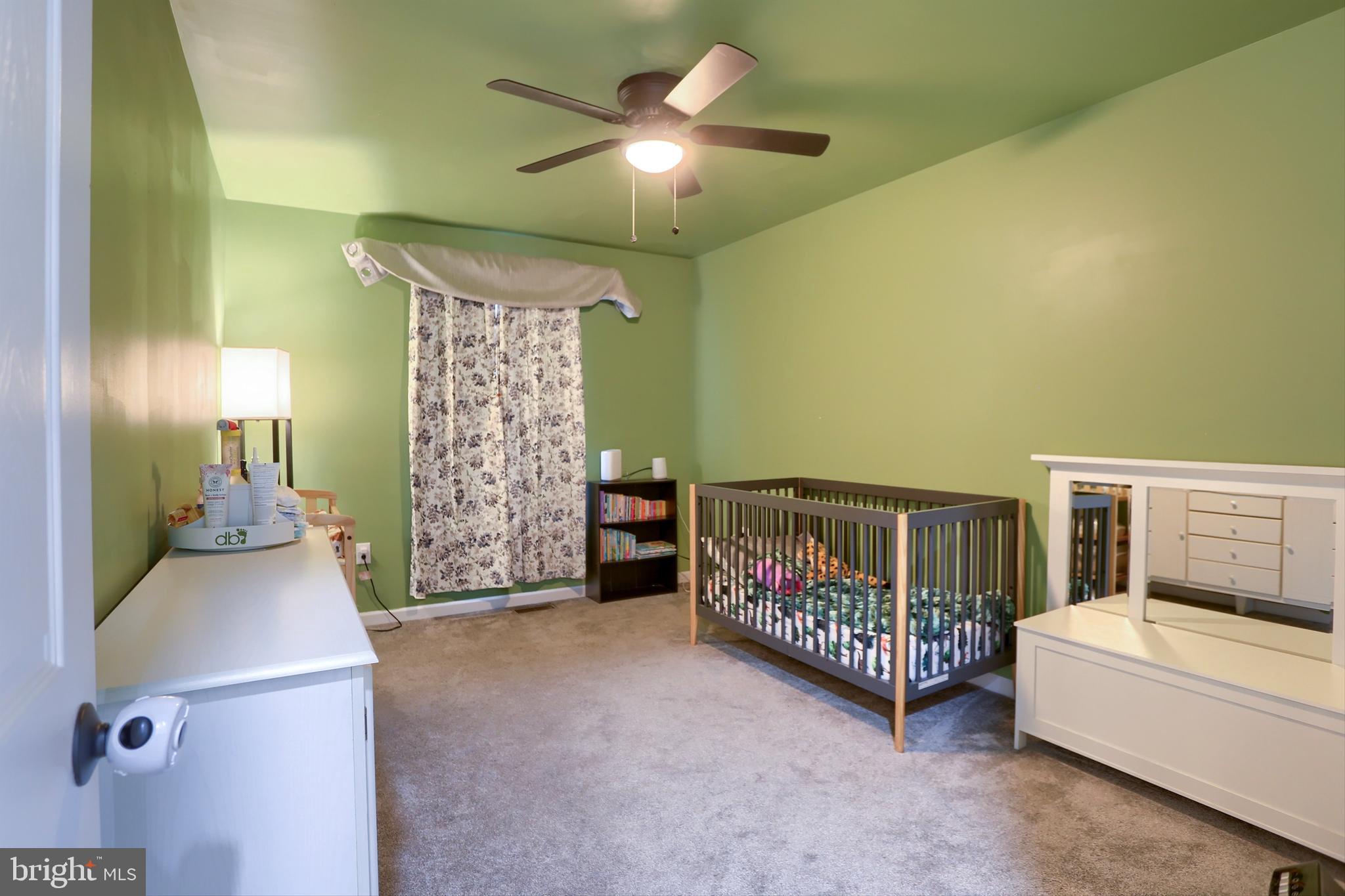 405 Small Valley Road Halifax, PA 17032 - Photo 23 of 36 a bedroom with a bed and a chandelier