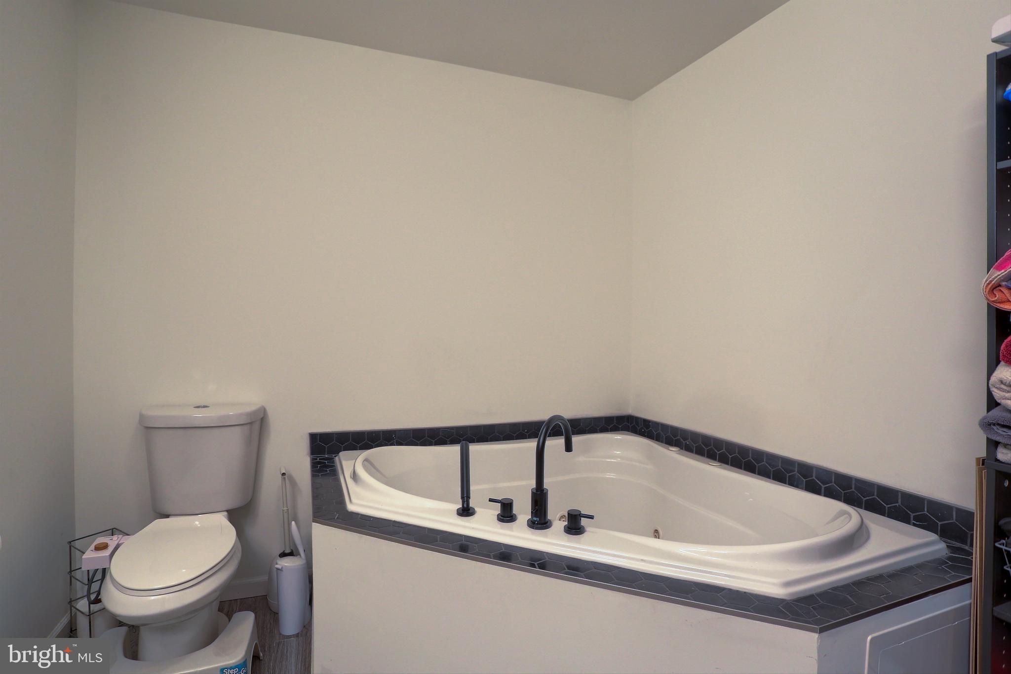 405 Small Valley Road Halifax, PA 17032 - Photo 26 of 36 a white bath tub sitting next to a toilet