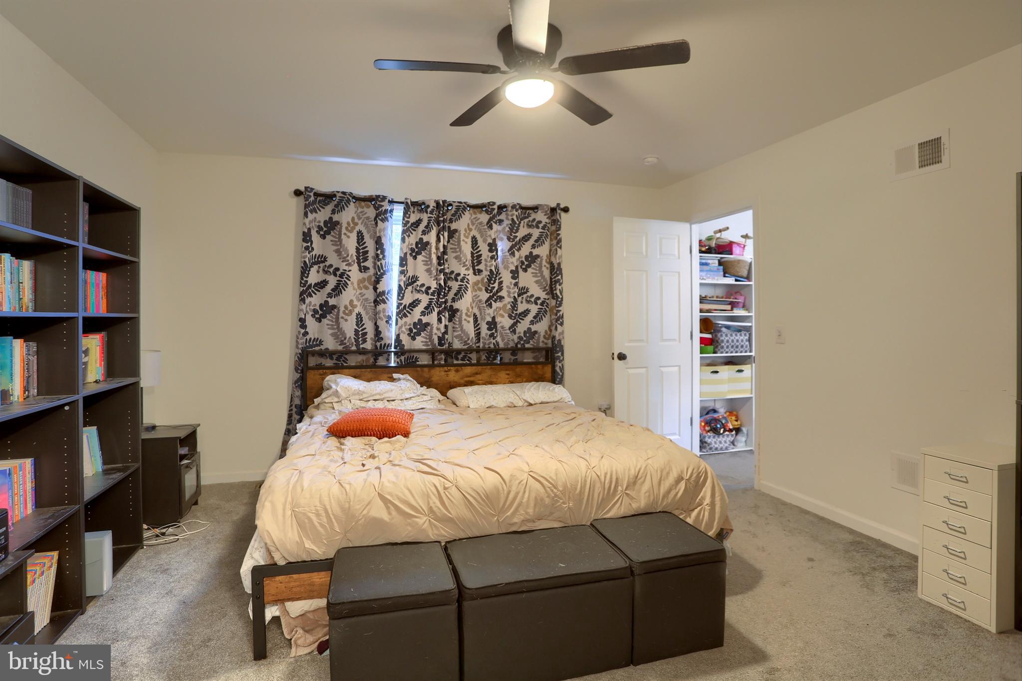 405 Small Valley Road Halifax, PA 17032 - Photo 29 of 36 a bedroom with a bed and a book shelf