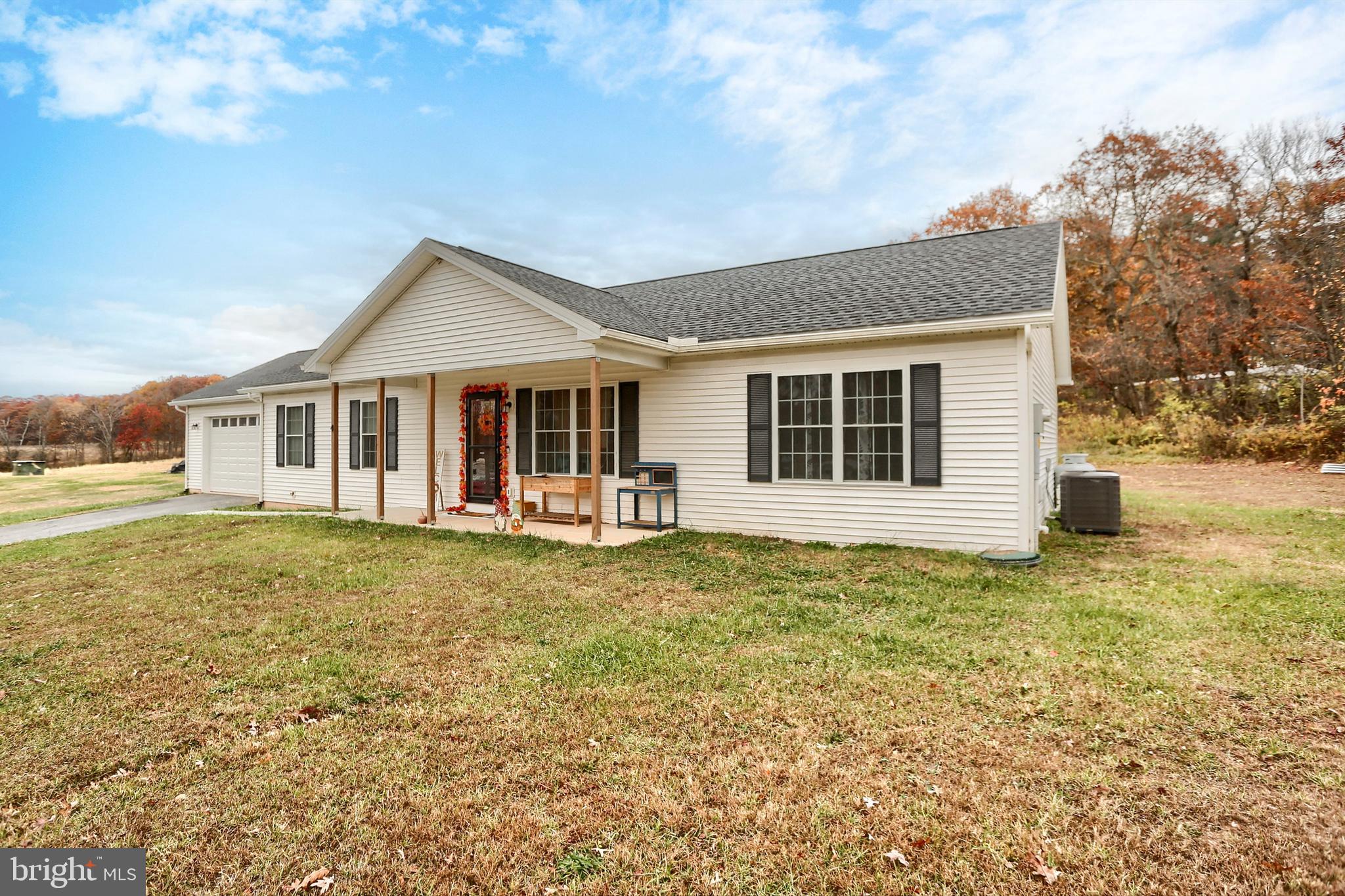405 Small Valley Road Halifax, PA 17032 - Photo 3 of 36 a house with trees in front of it
