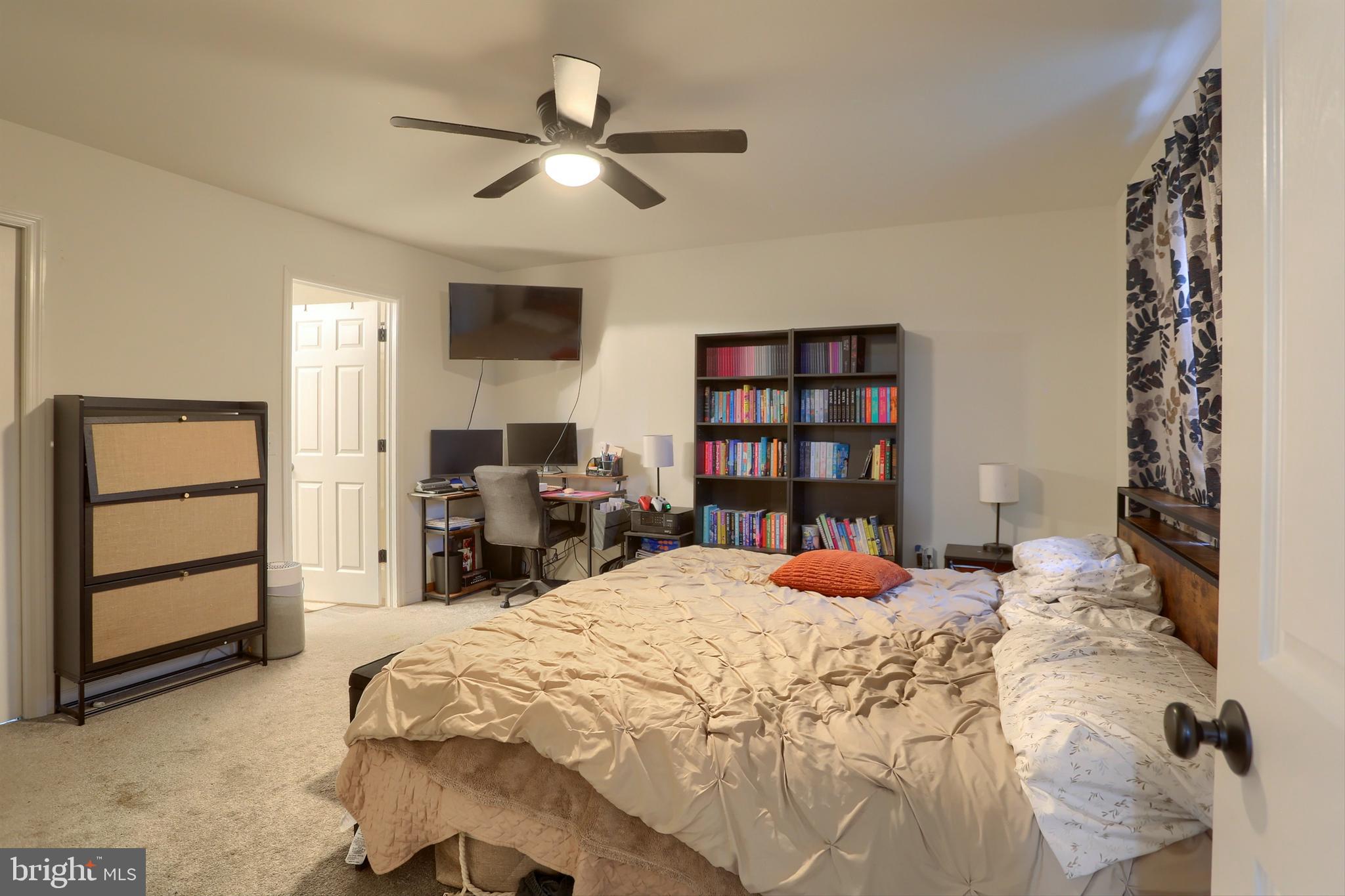 405 Small Valley Road Halifax, PA 17032 - Photo 31 of 36 a bedroom with a bed and a book shelf