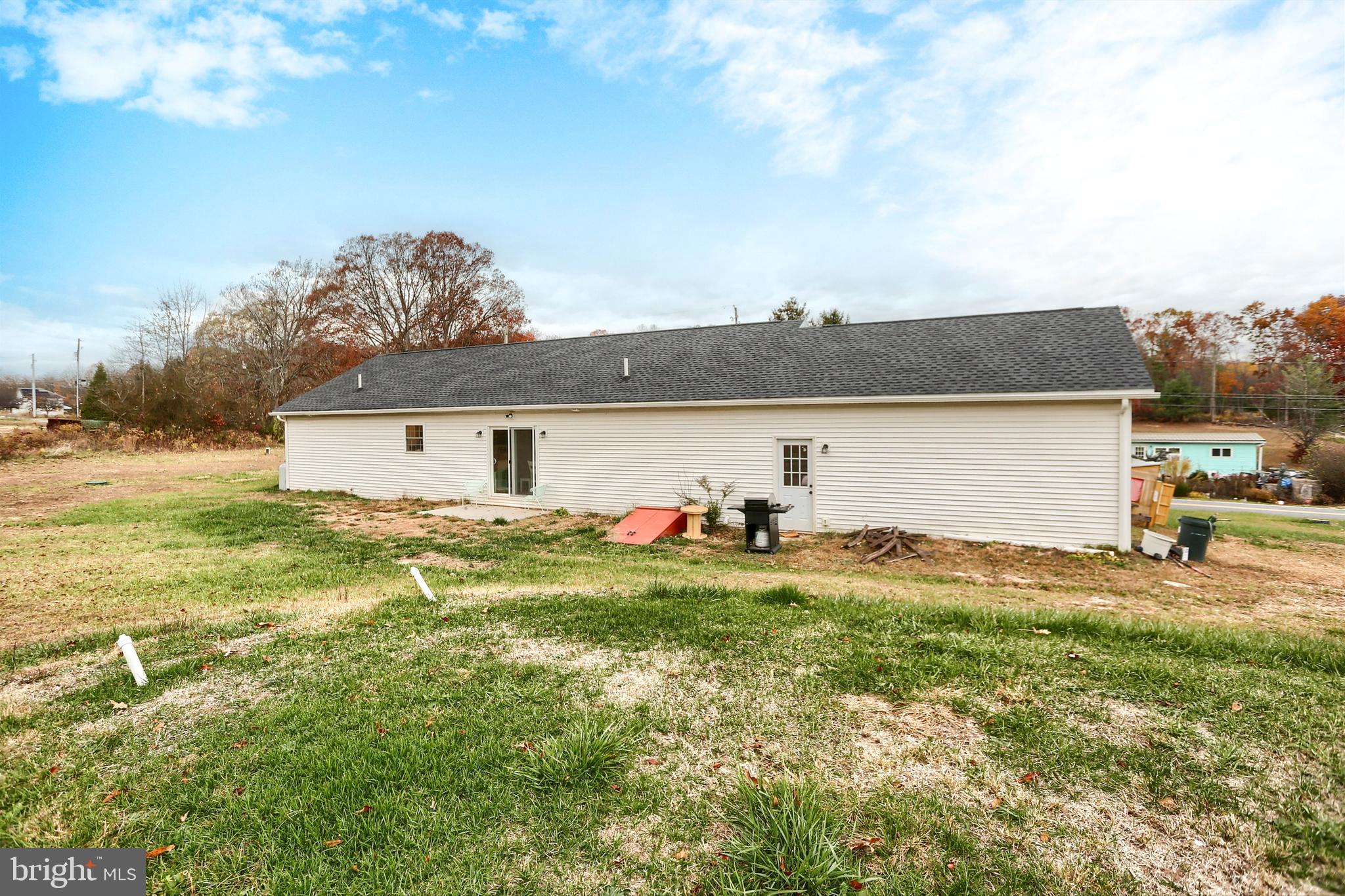 405 Small Valley Road Halifax, PA 17032 - Photo 32 of 36 a view of a house with backyard and a tree