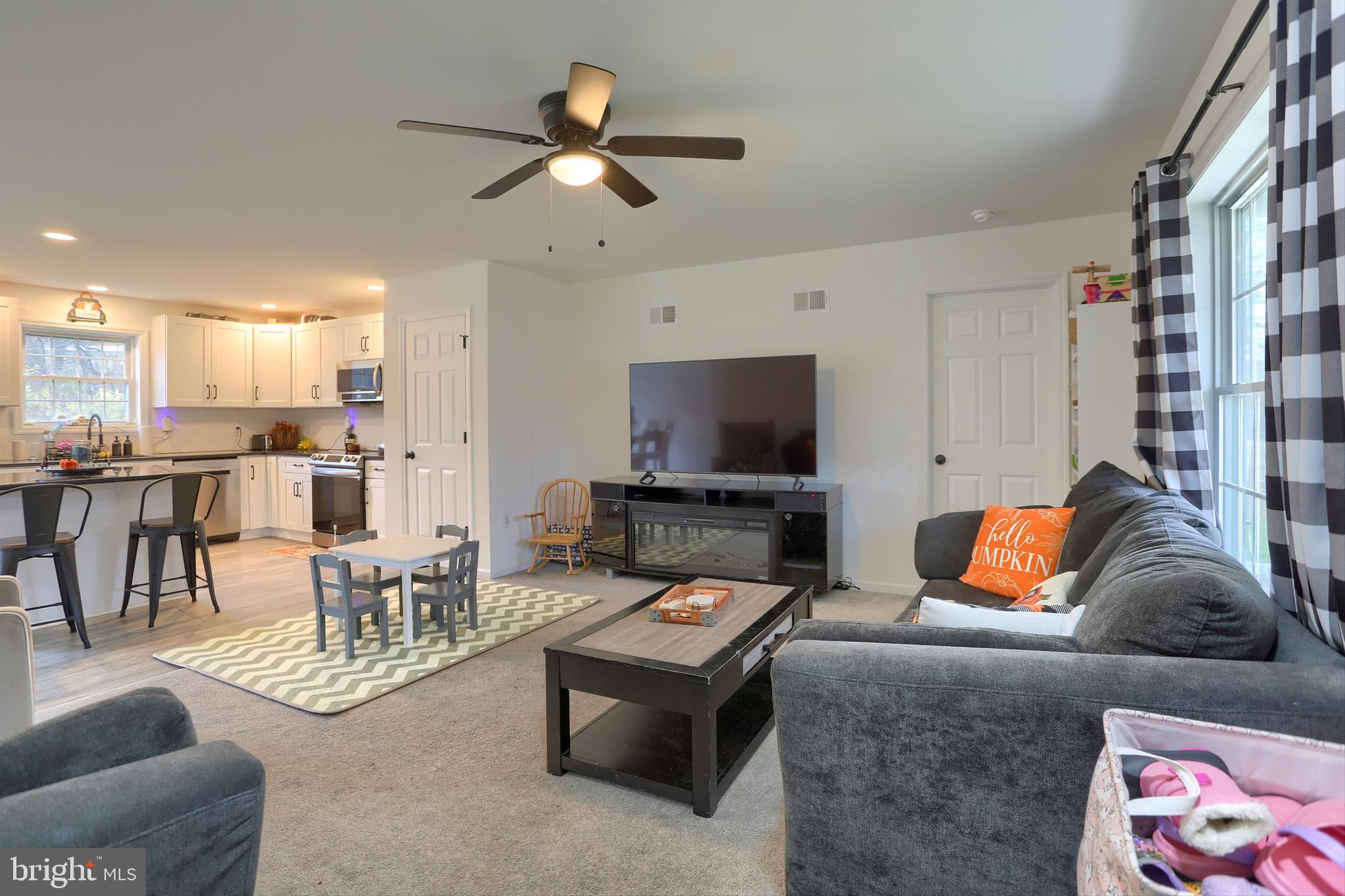 405 Small Valley Road Halifax, PA 17032 - Photo 8 of 36 a living room with furniture and a flat screen tv