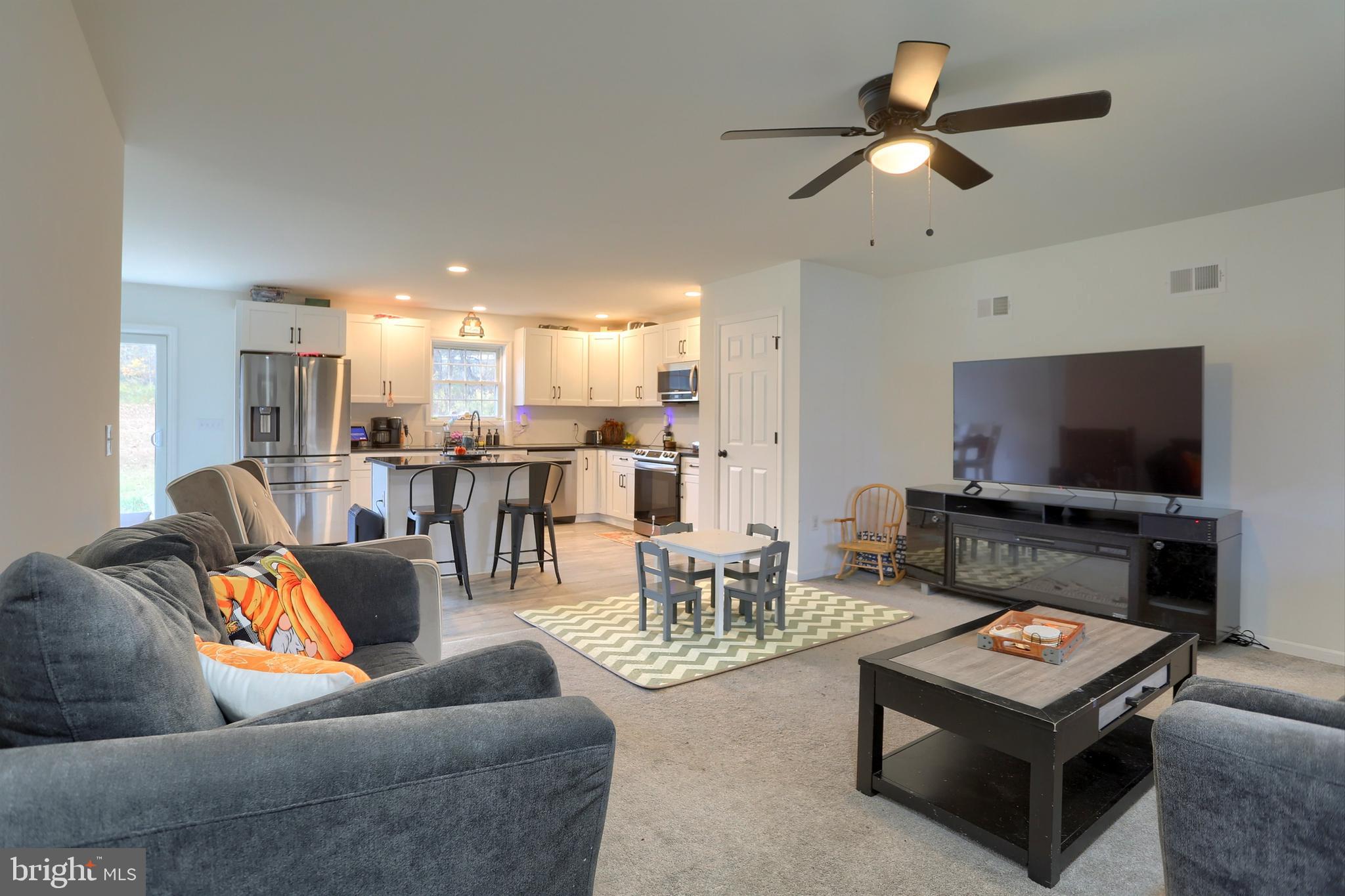 405 Small Valley Road Halifax, PA 17032 - Photo 9 of 36 a living room with furniture and a flat screen tv