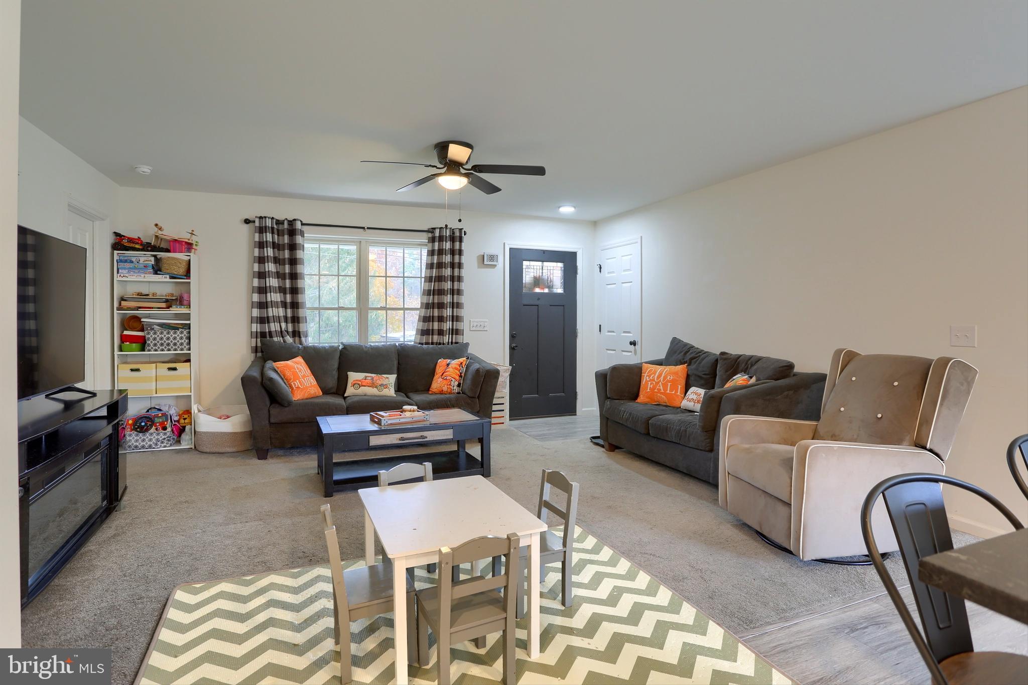 405 Small Valley Road Halifax, PA 17032 - Photo 10 of 36 a living room with furniture and a flat screen tv