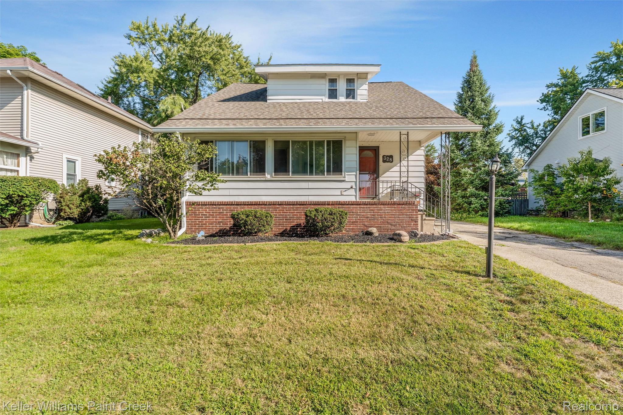 328 Ferndale Avenue Rochester, MI 48307 - Photo 53 of 54 White siding exterior with a red brick foundation