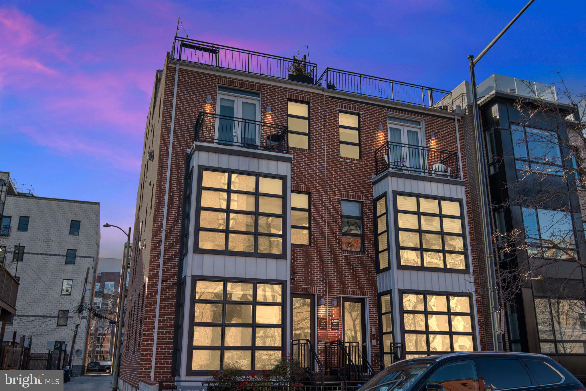 2106 10th Street Northwest, Unit 1 Washington, DC 20001 - Photo 1 of 31 a front view of a residential apartment building with a glass door