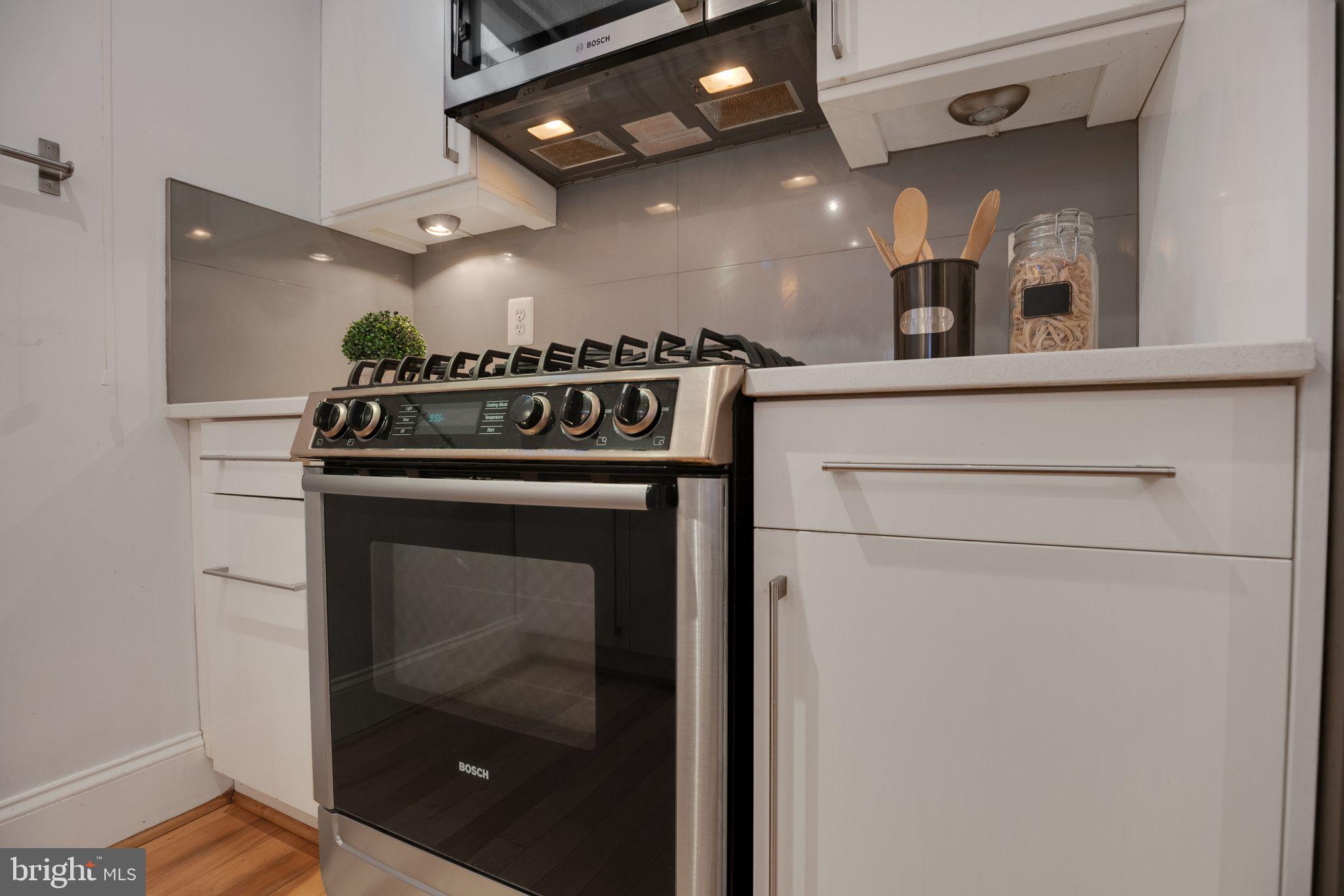 2106 10th Street Northwest, Unit 1 Washington, DC 20001 - Photo 11 of 31 a close view of a stove top oven sitting inside of a kitchen